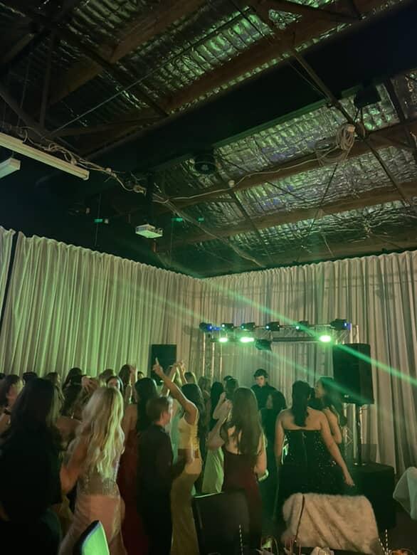 MM Events Melbourne DJ setup with colourful stage lighting at a live event